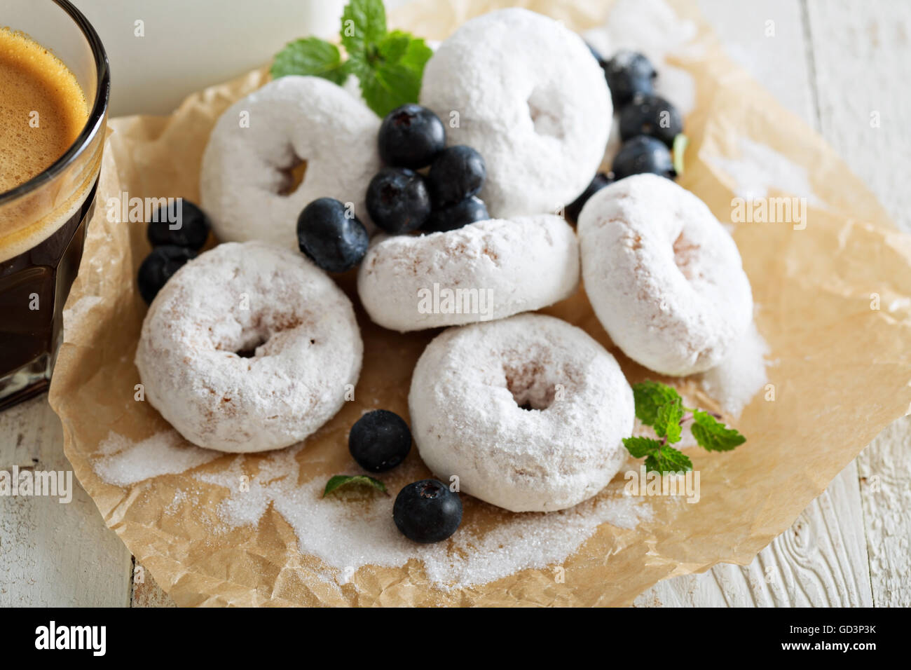 Small donuts in powdered sugar Stock Photo