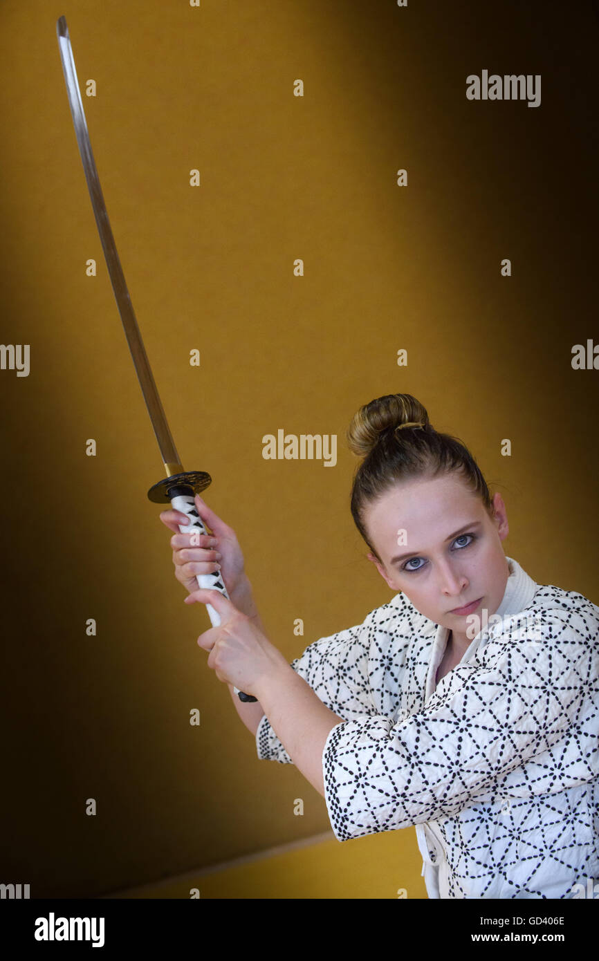 Berlin, Germany. 06th July, 2016. Vivien Weiselowski demonstrates the use of the japanese long sword (Katana). The student teacher from Berlin practices the art of Japanese swordsmanship Kenjutsu for three years now. | usage worldwide © dpa/Alamy Live News Stock Photo