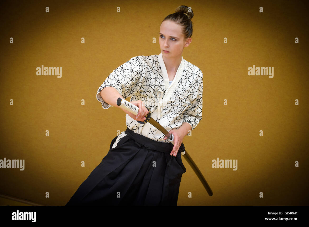 Berlin, Germany. 06th July, 2016. Vivien Weiselowski demonstrates the use of the japanese long sword (Katana). The student teacher from Berlin practices the art of Japanese swordsmanship Kenjutsu for three years now. | usage worldwide © dpa/Alamy Live News Stock Photo