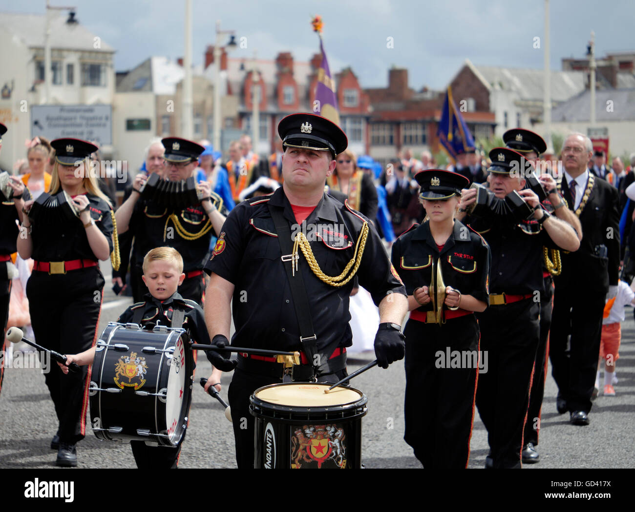 Southport, Merseyside, UK. 12th July, 2016. The Orange Lodge Parade marching through Southport. Merseyside. 12 July 2016. The parade's history goes back over three centuries to the Battle of the Boyne in 1690 when King William III of Orange defeated his rival King James II.This year's walk is also in memory of the 100th anniversary of the Battle of the Somme. Credit:  ALAN EDWARDS/Alamy Live News Stock Photo