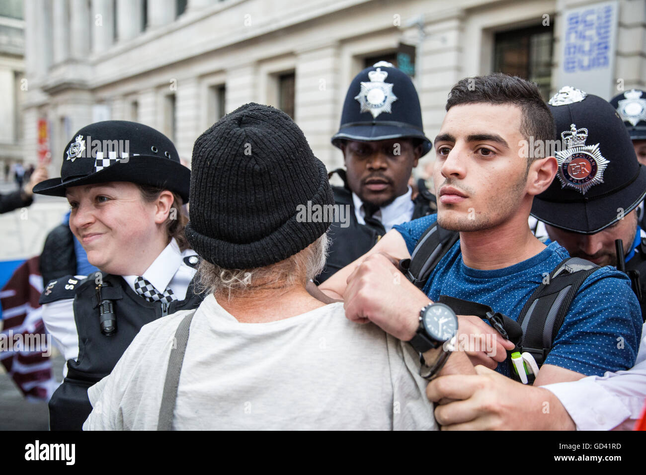 London, UK. 11th July, 2016. Bahraini human rights campaigner Isa Alaali is arrested while protesting outside an official reception for the Farnborough International arms fair attended by arms dealers at the Science Museum. Some arms dealers attending the reception are believed to have been turned away as a result of the protest organised by the Campaign Against Arms Trade. Protesters were objecting in particular to arms sales to Saudi Arabia, used in human rights abuses against the Yemeni people. Credit:  Mark Kerrison/Alamy Live News Stock Photo