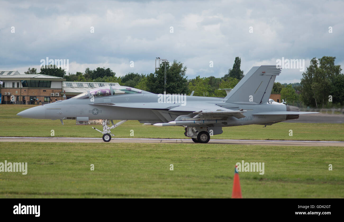 Farnborough, Hampshire UK. 12th July 2016. Boeing F/A-18 Flying Display. Day 2 of the Farnborough International Trade Airshow and flying demonstrations of commercial and military aircraft proceed in cloudy weather. Credit:  aviationimages/Alamy Live News. Stock Photo