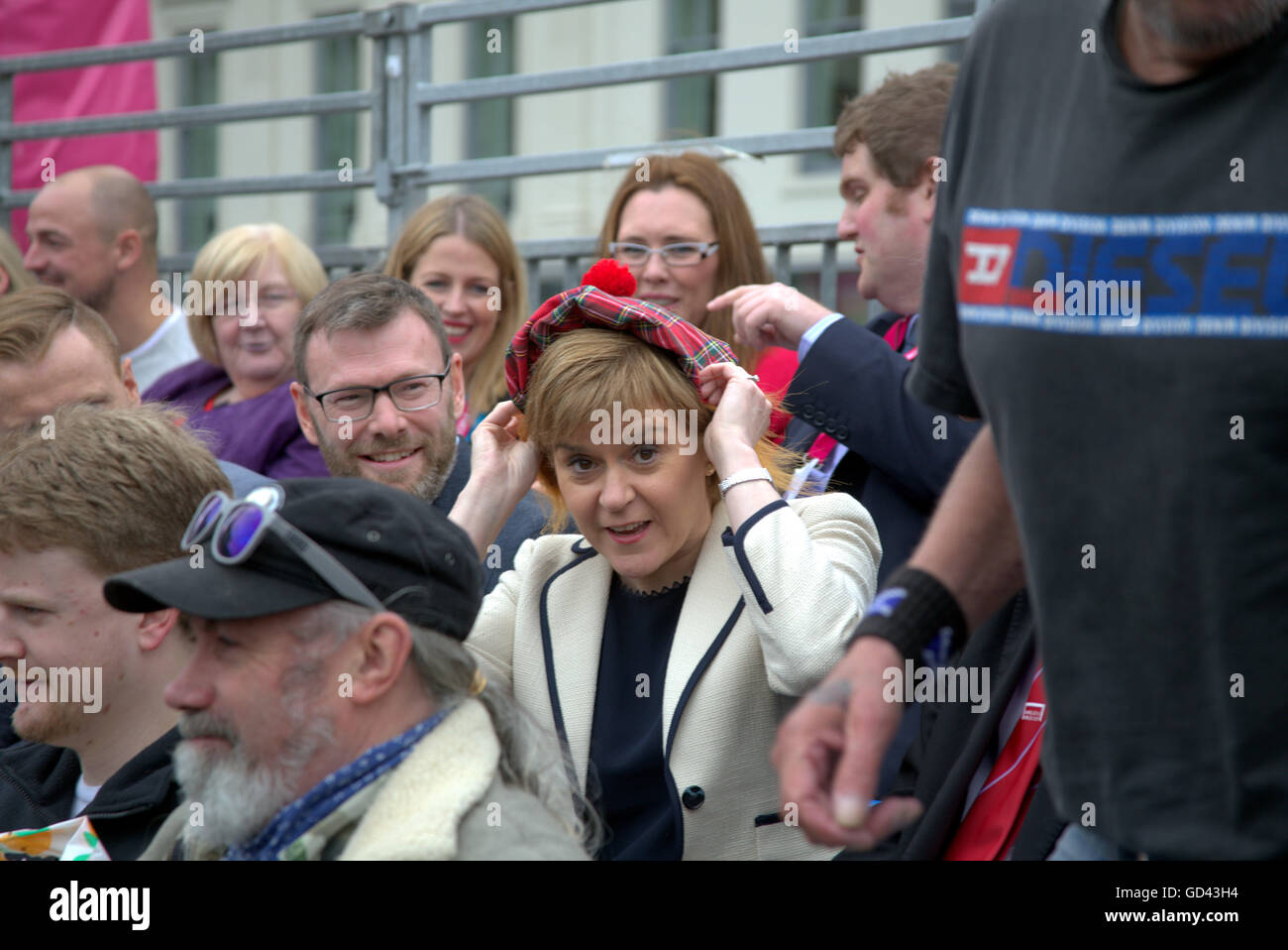 Glasgow, Scotland, UK 12th July 2016. Nicola Sturgeon dons See You Jimmy hat  at  Homeless World Cup in the heart of Glasgow, ,a seven day event, in Glasgow’s George Square will be “the most inspiring place on the planet.” Attended today by Nicola Sturgeon Scotland’s first minister.  Credit:  Gerard Ferry/Alamy Live News Stock Photo