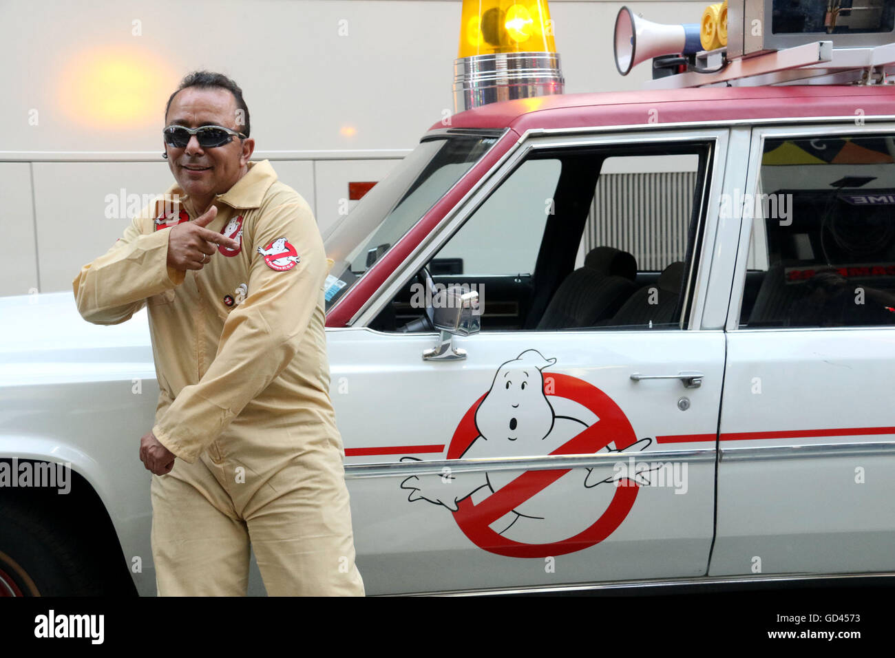 New York, USA. 12th July, 2016. VICTOR stands in front of the 2016 Ghostbusters new Ecto-1 80's Cadillac Fleetwood Station Wagon in Times Square. Credit:  Nancy Kaszerman/ZUMA Wire/Alamy Live News Stock Photo