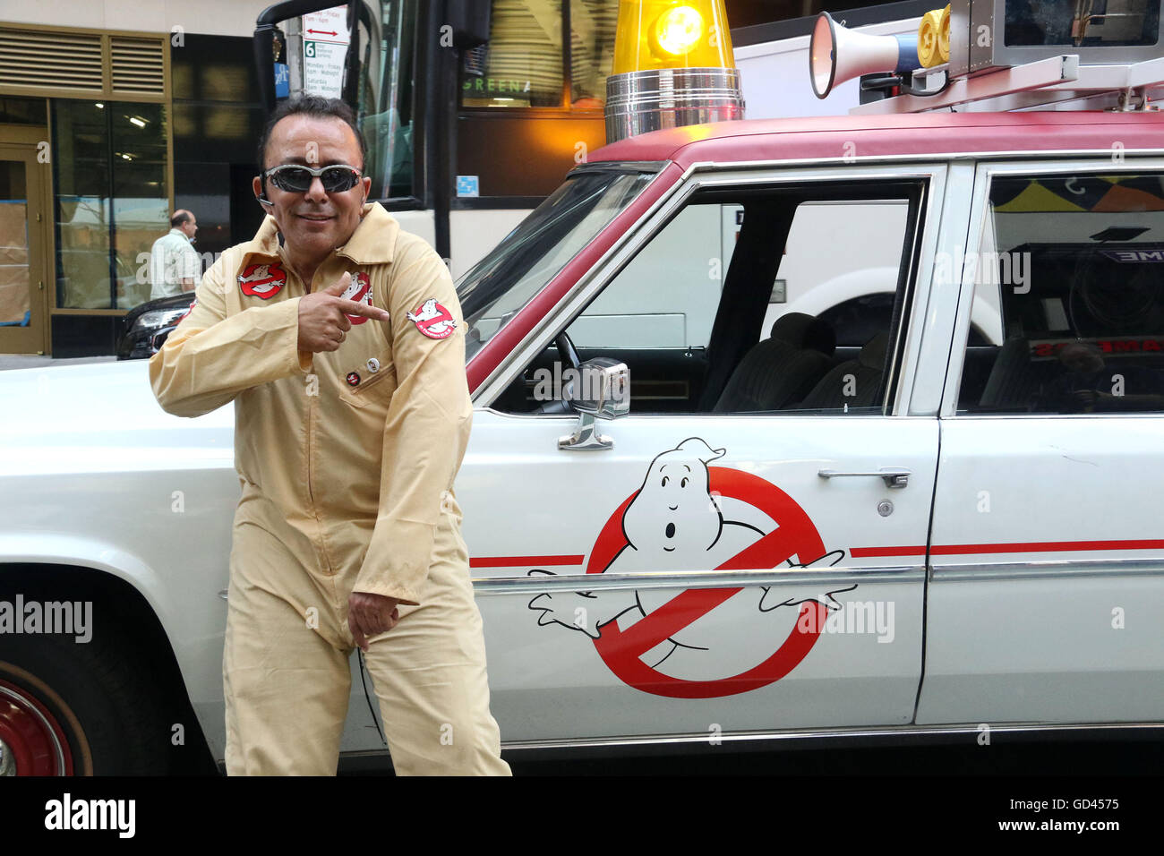New York, USA. 12th July, 2016. VICTOR stands in front of the 2016 Ghostbusters new Ecto-1 80's Cadillac Fleetwood Station Wagon in Times Square. Credit:  Nancy Kaszerman/ZUMA Wire/Alamy Live News Stock Photo