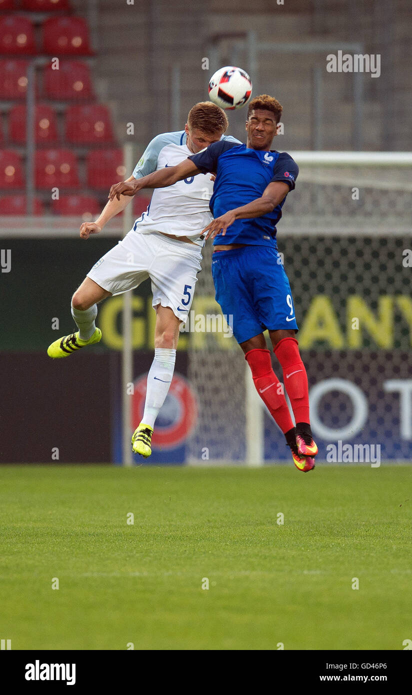 Heidenheim, Germany. 12th July, 2016. England's taylor moore (l) in a header duel against France's Florian Aye (r) in the group match of group B, France against England, on the first match day of the U 19 European Championship at the Voith arena in Heidenheim, Germany, 12 July 2016. Photo: Deniz Calagan/dpa/Alamy Live News Stock Photo