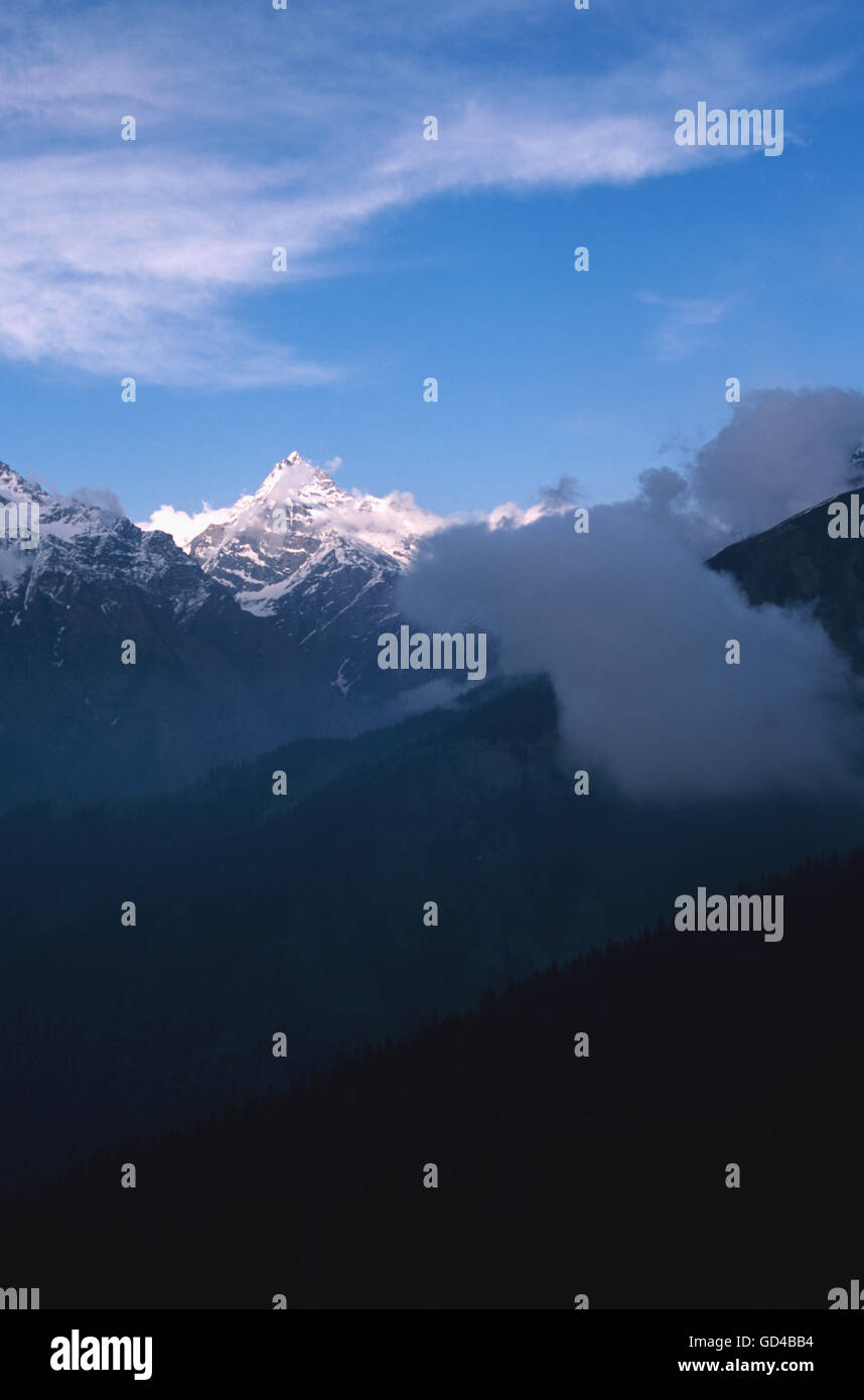 Snow capped mountains with clouds Stock Photo - Alamy