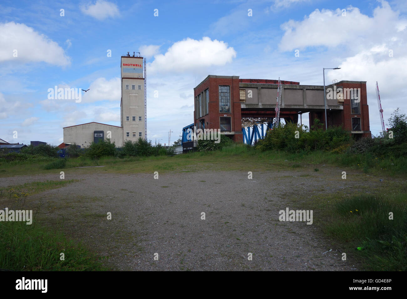 Kingston on Hull  Shotwell lead shot tower and tidal defences on river Hull Stock Photo