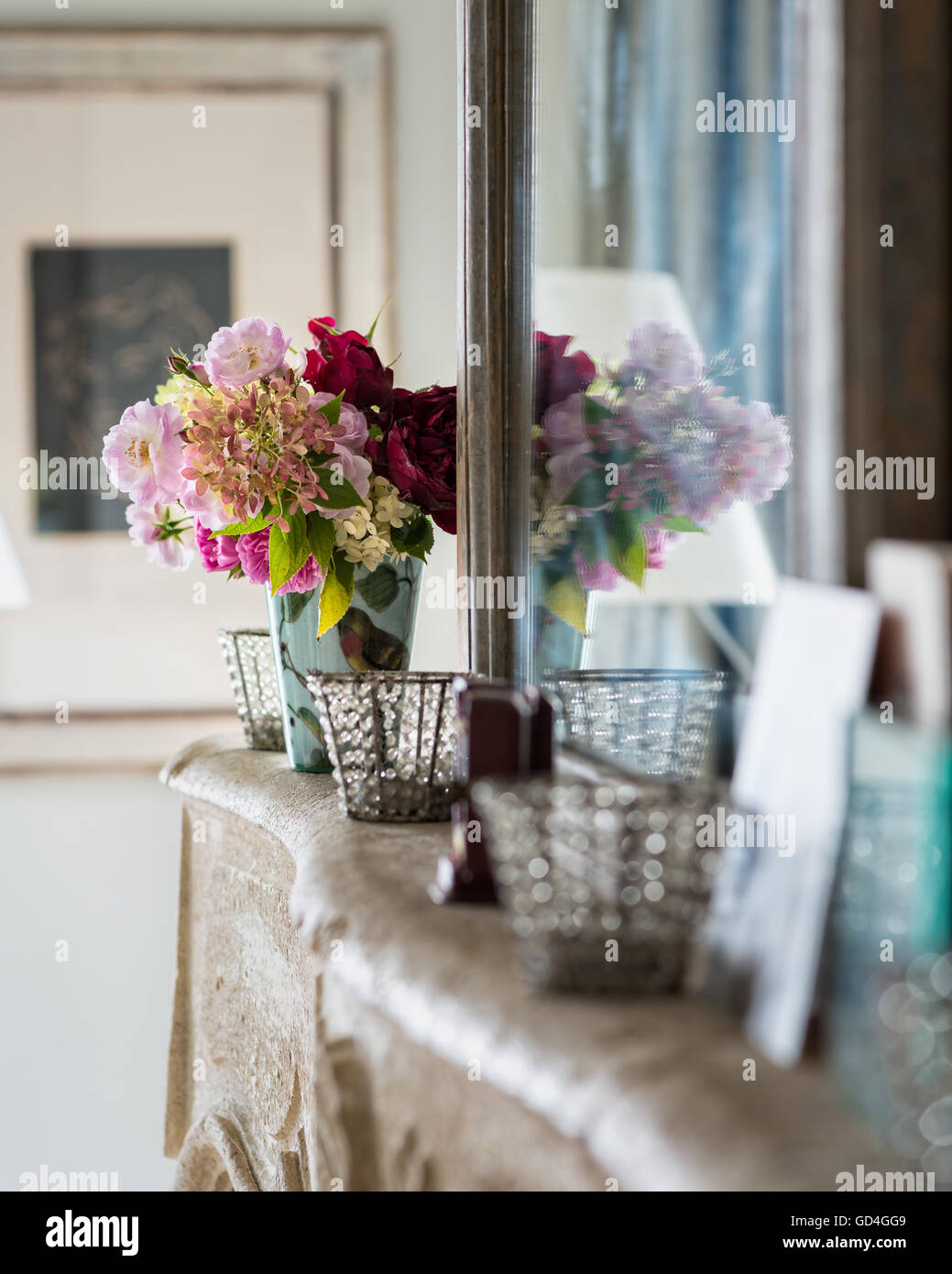 Assorted roses on mantlepiece Stock Photo