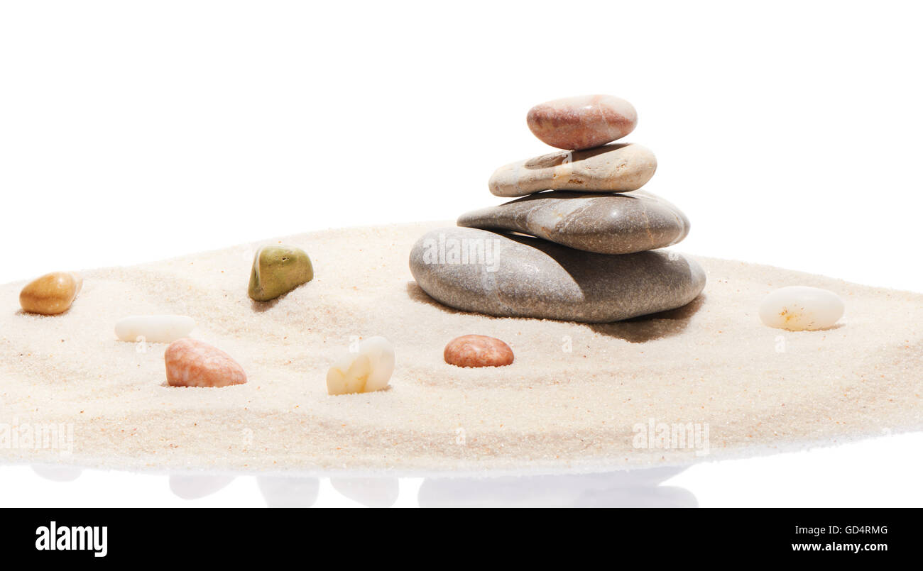 Japanese zen stone garden and sea stones on beach sand, isolated on white background Stock Photo