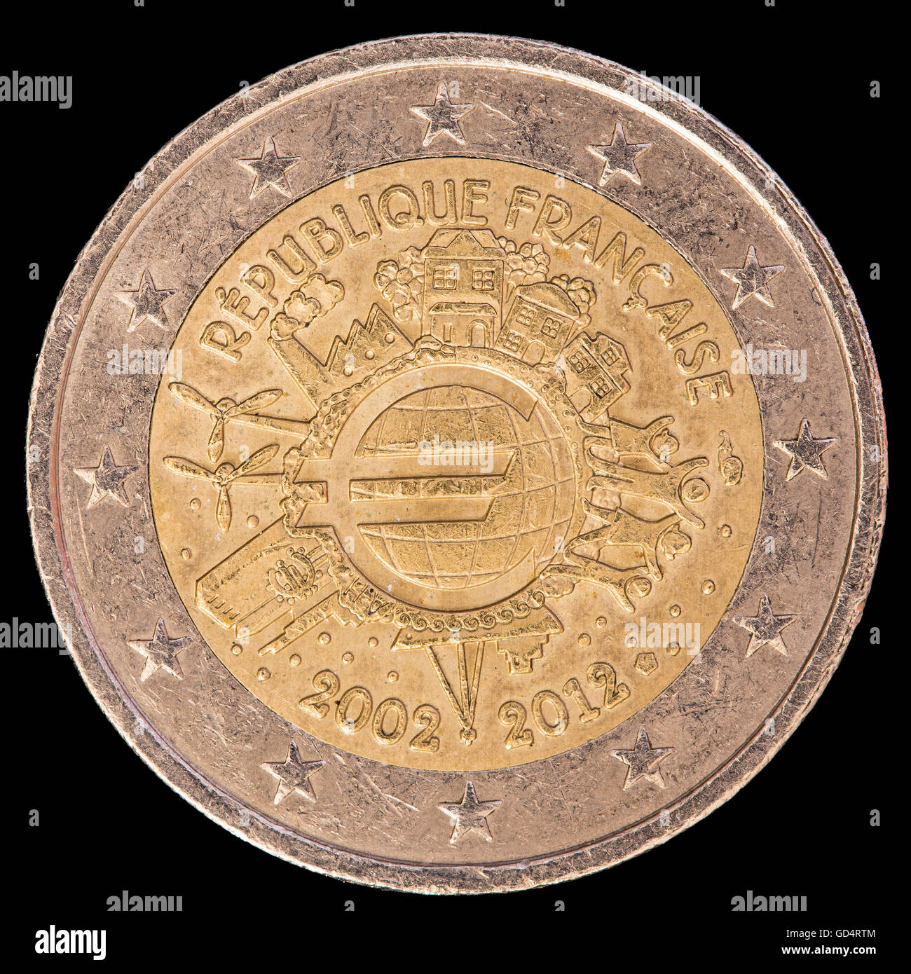 A commemorative circulated two euro coin issued by France in 2012 and celebrating the ten years of the Euro. Image isolated on b Stock Photo