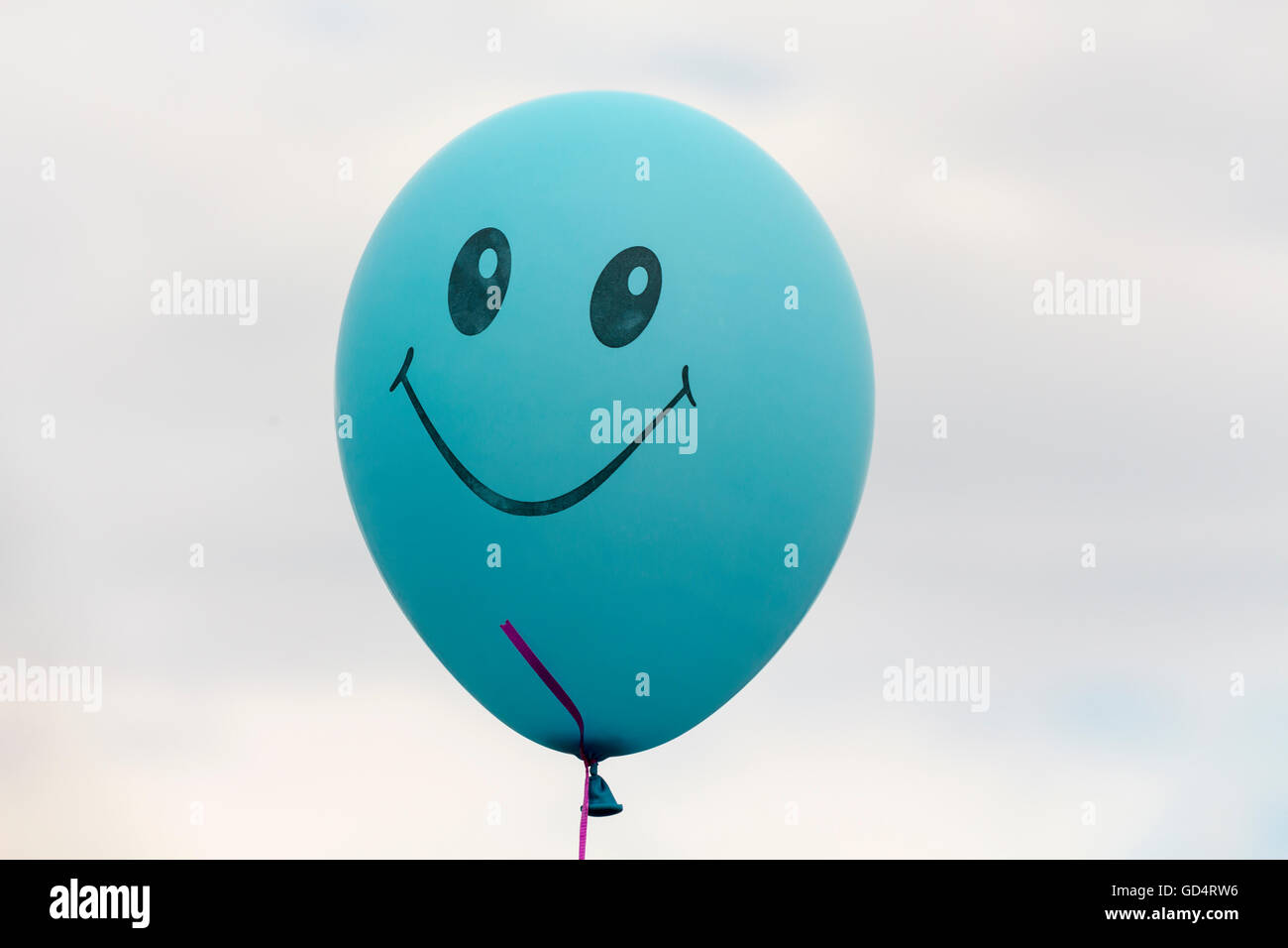 Balloon with a smiley face Stock Photo - Alamy