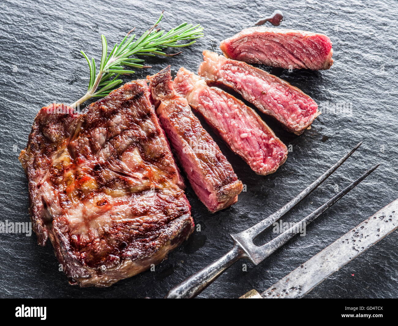 Medium Rib eye steak on the graphite tray Stock Photo - Alamy