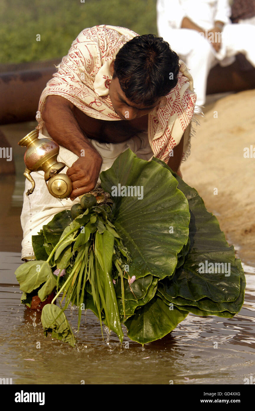 Devotees performing ritual Stock Photo - Alamy