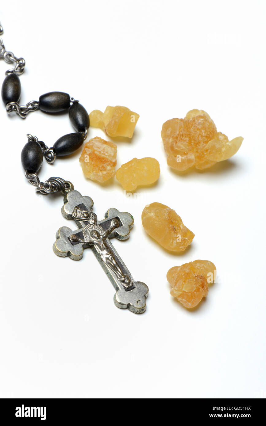 Crucifix and frankincense resin Stock Photo