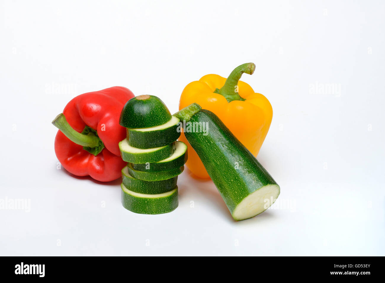 Pepper and Zuccini / (Cucurbita pepo var. giromontiina), (Capsicum annuum) Stock Photo