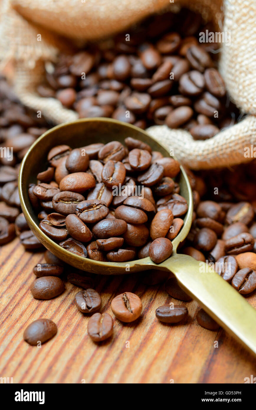 roasted coffee beans in ladle Stock Photo