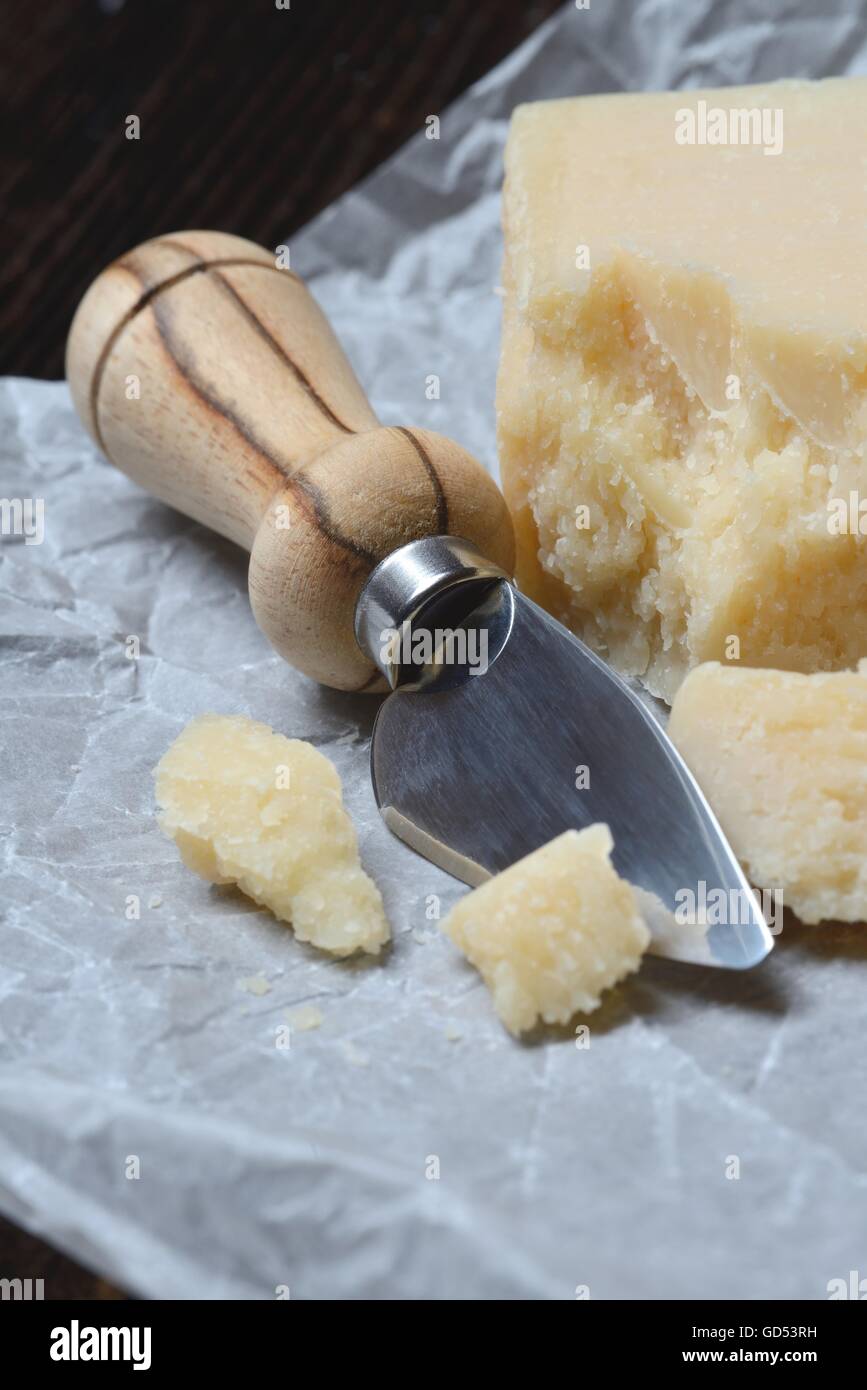 Parmesan mit Kaesemesser, Grana Padano, Kaesemesser Stock Photo