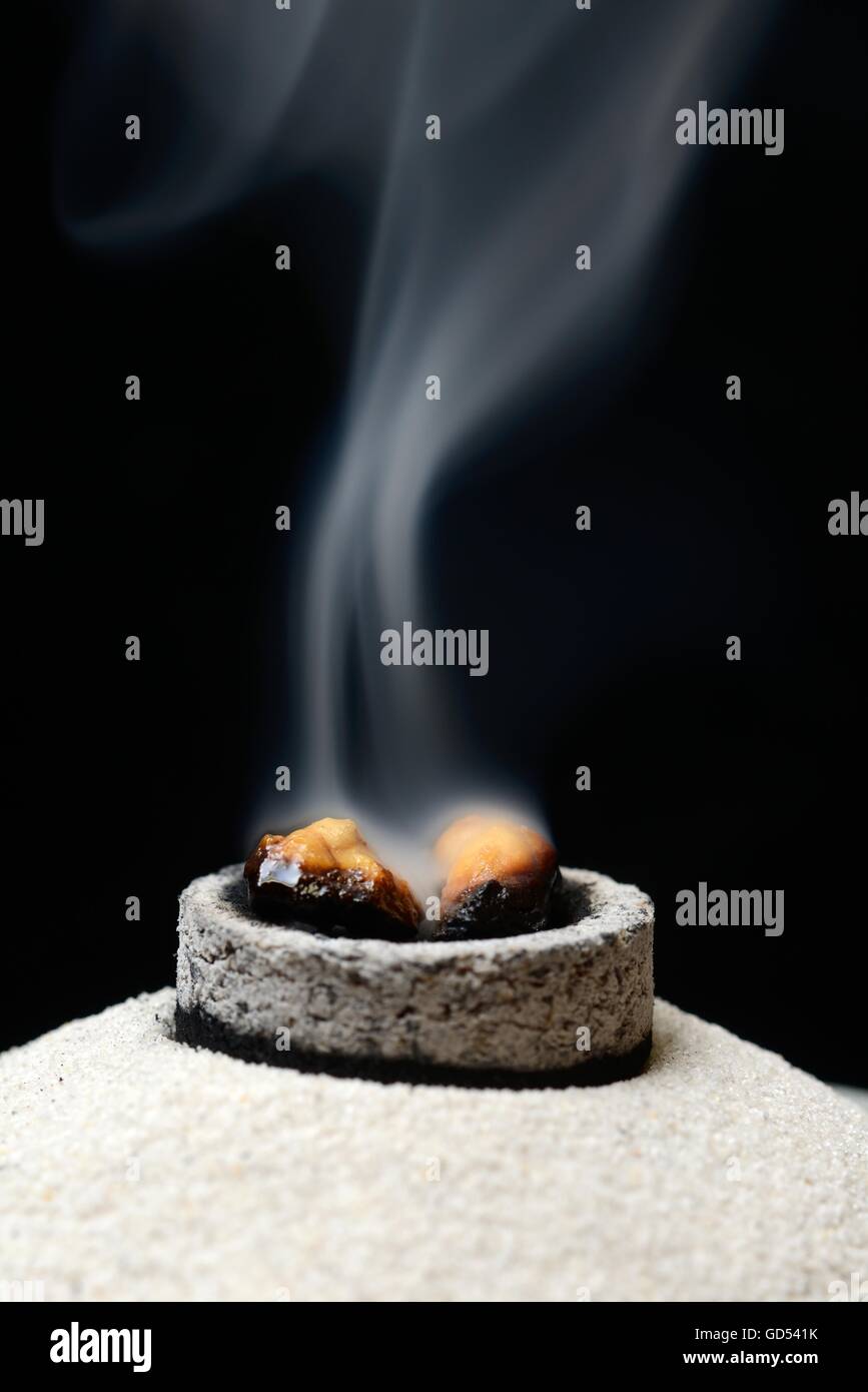 burning frankincense with incense coal Stock Photo Alamy