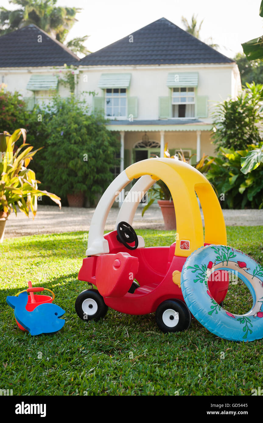 Plastic toys on lawn of Leamington House villa, Barbados Stock Photo