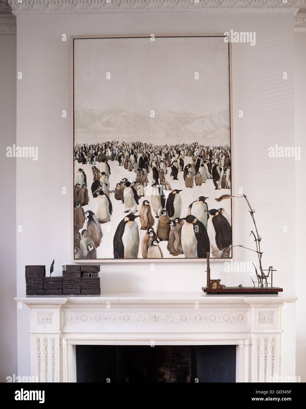 Norma Miller penguin painting above fireplace Stock Photo
