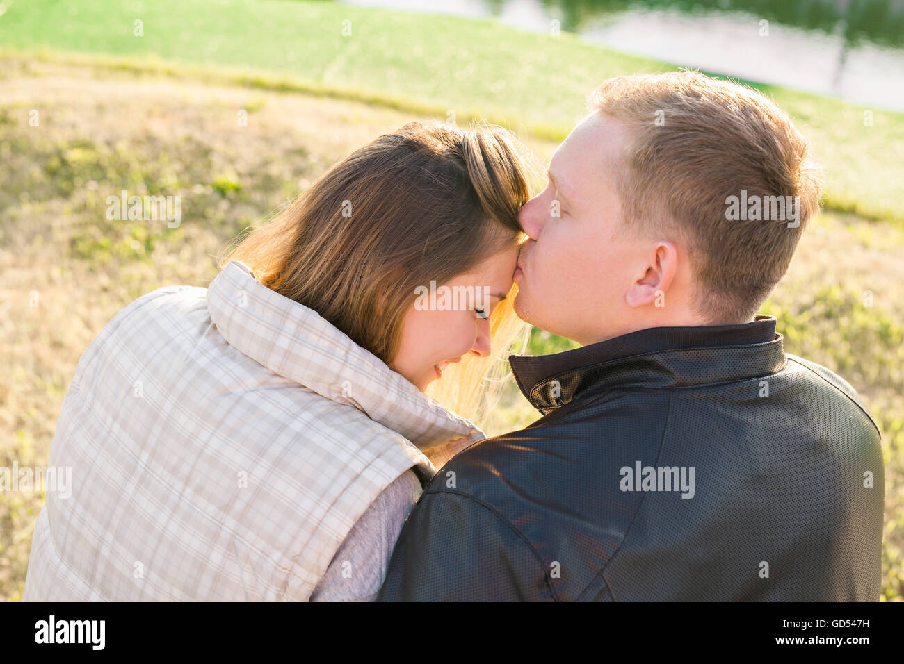 Romantic couple kissing in nature · Free Stock Photo