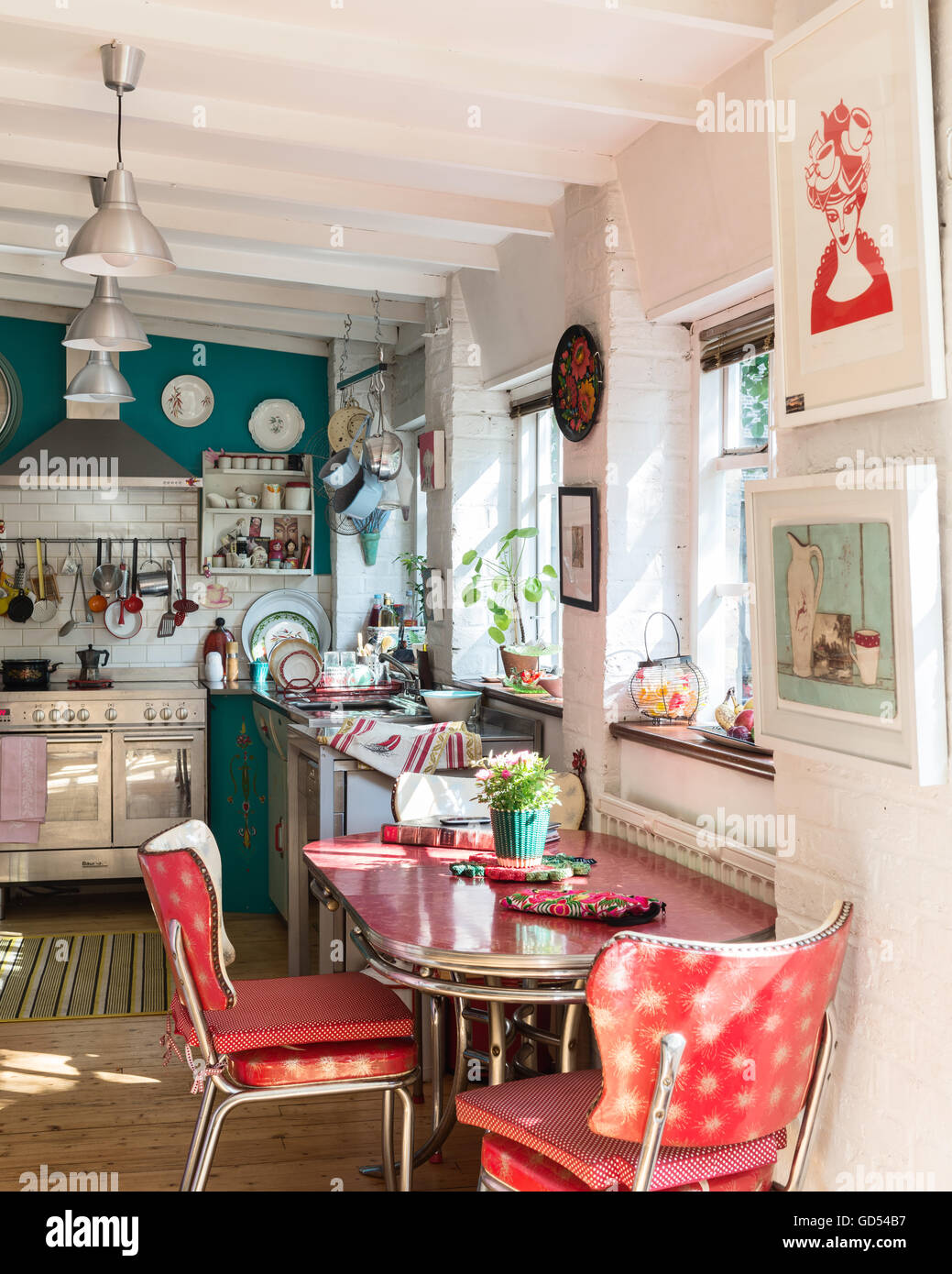 Vintage style kitchen with pendant lights and range cooker Stock Photo