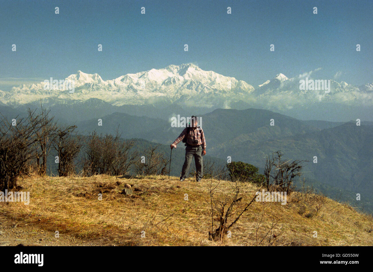 Trekker standing in front of the Kanchenjunga Stock Photo