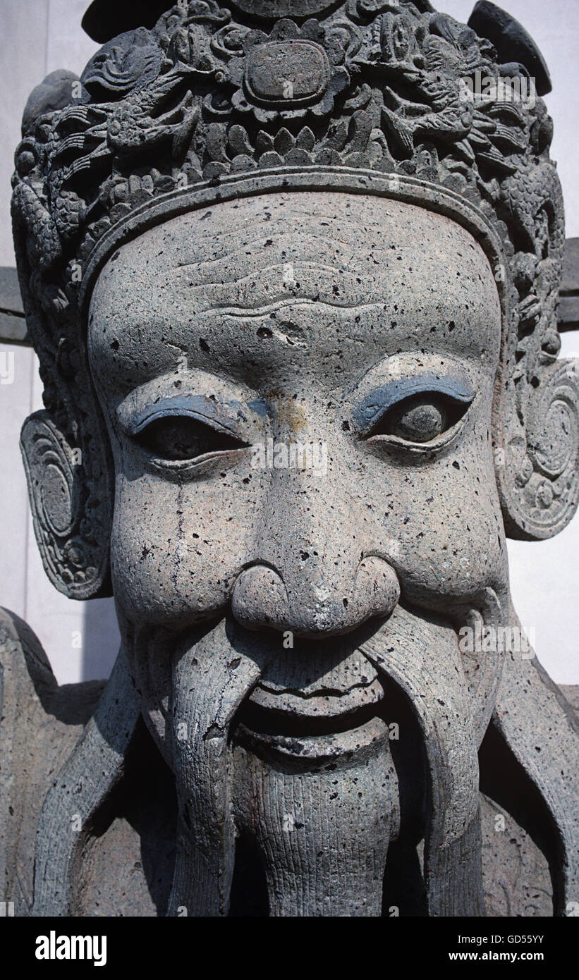 Face of a Chinese stone statue Stock Photo