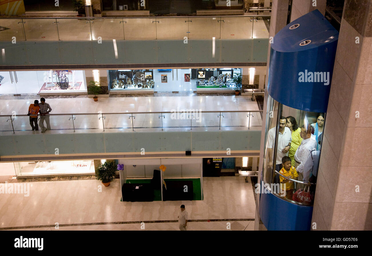 People travelling in a lift at ambi mall hi-res stock photography and ...