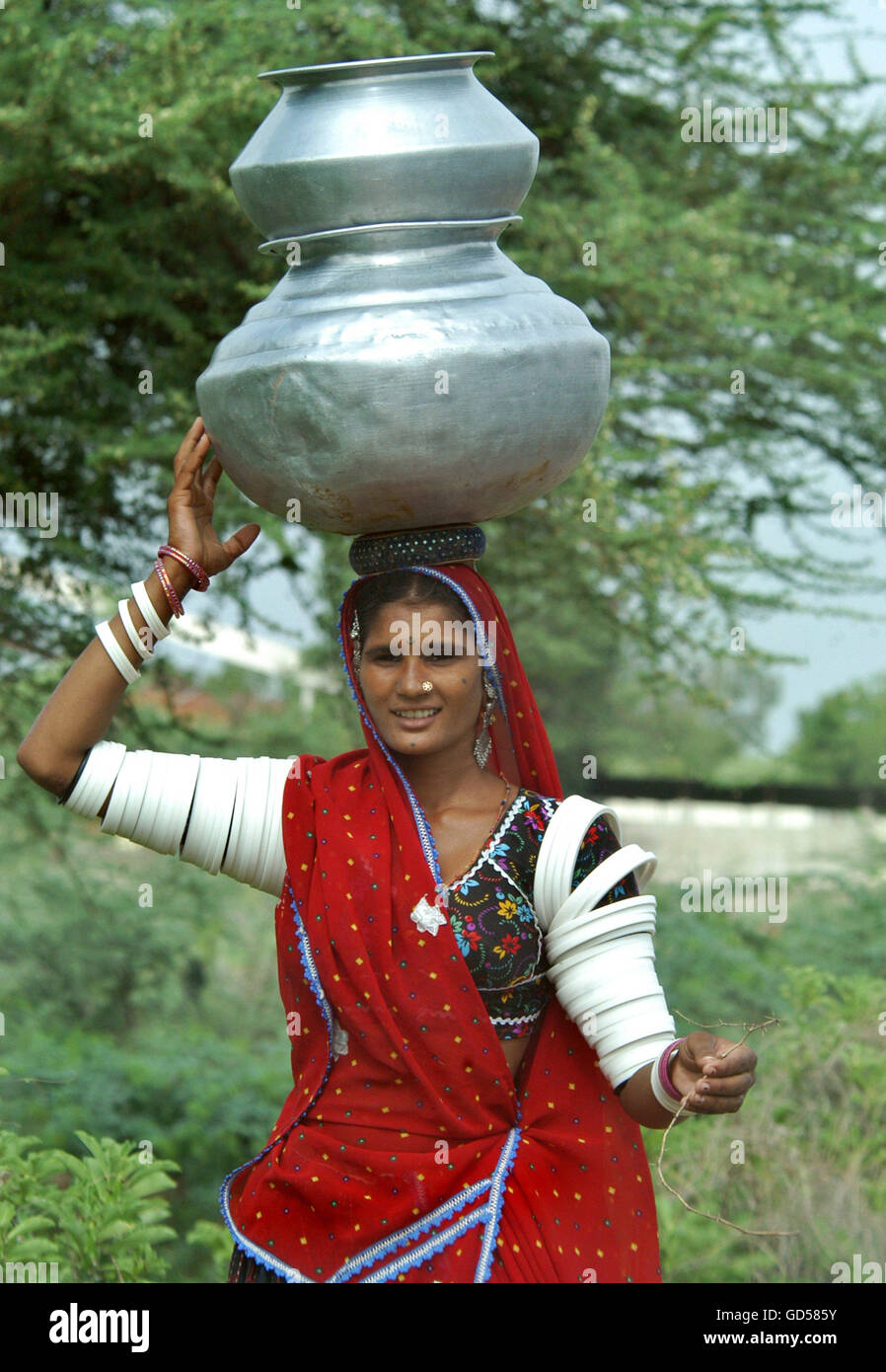 Tribal women carrying water pot hires stock photography and images Alamy
