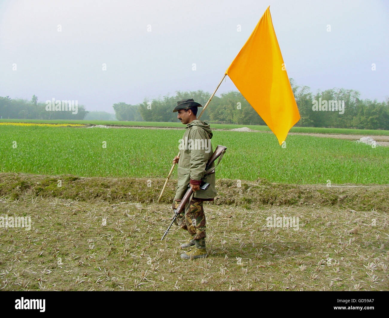 Army man holding a flag Stock Photo