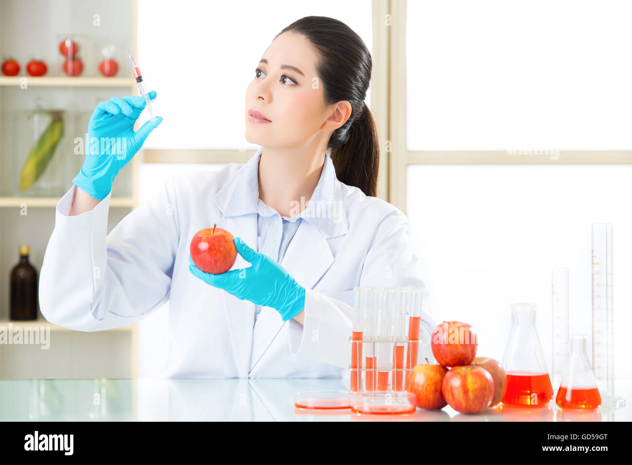 human try to make better genetic modification food in laboratory Stock Photo