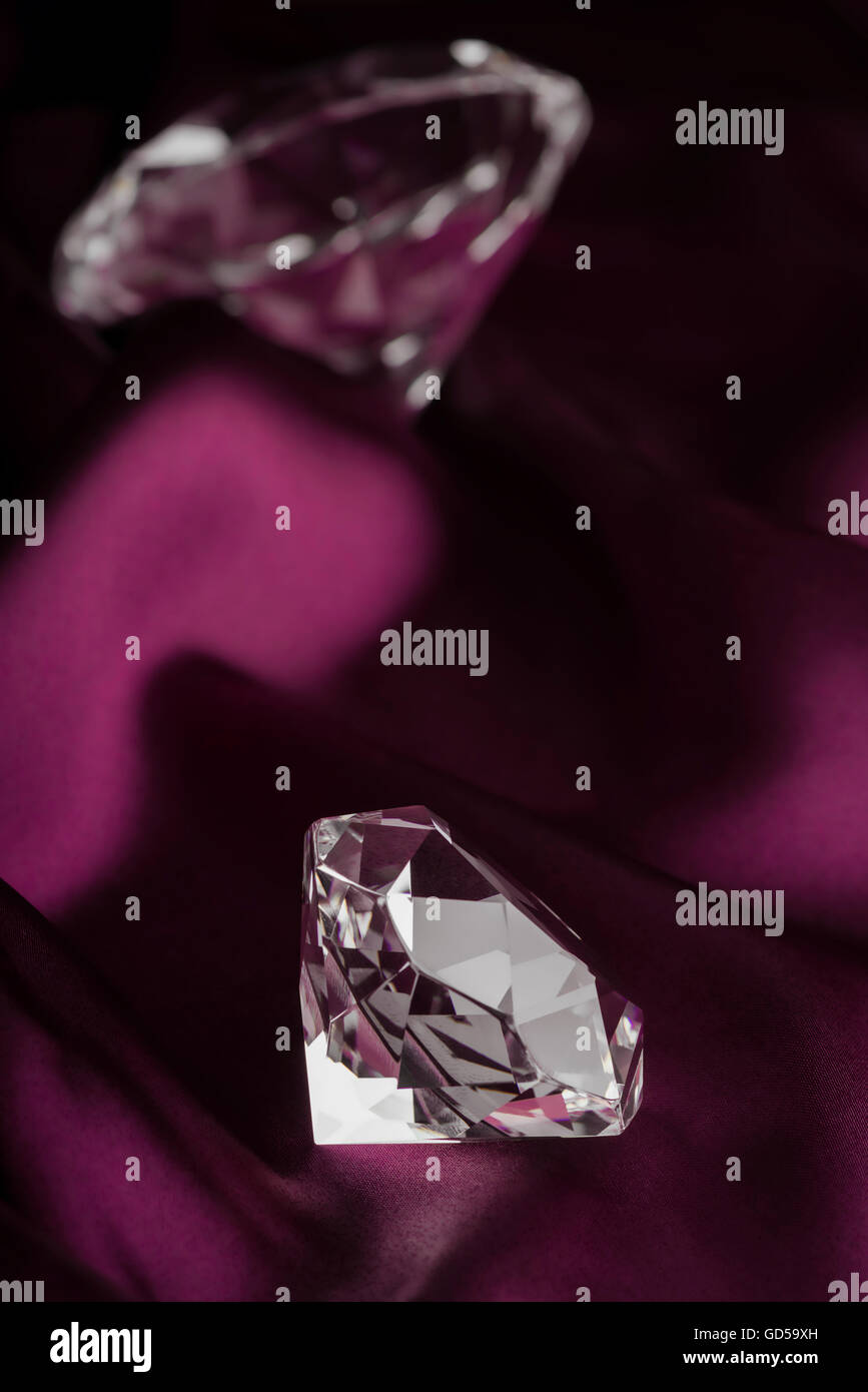 Expensive Translucent Diamonds over Purple Silk Fabric Stock Photo Alamy