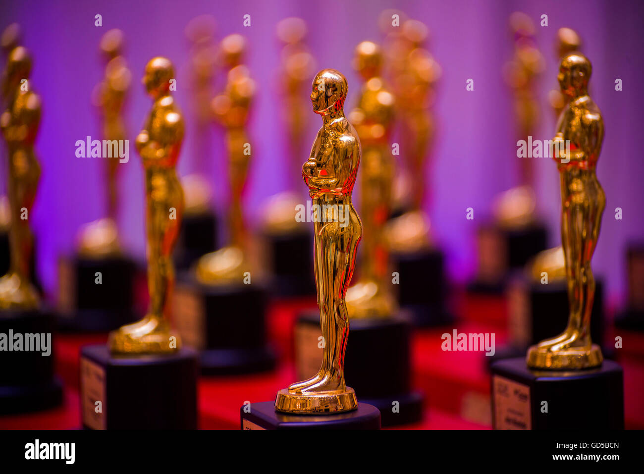 Group of Shiny Golden Prize Statues Stock Photo