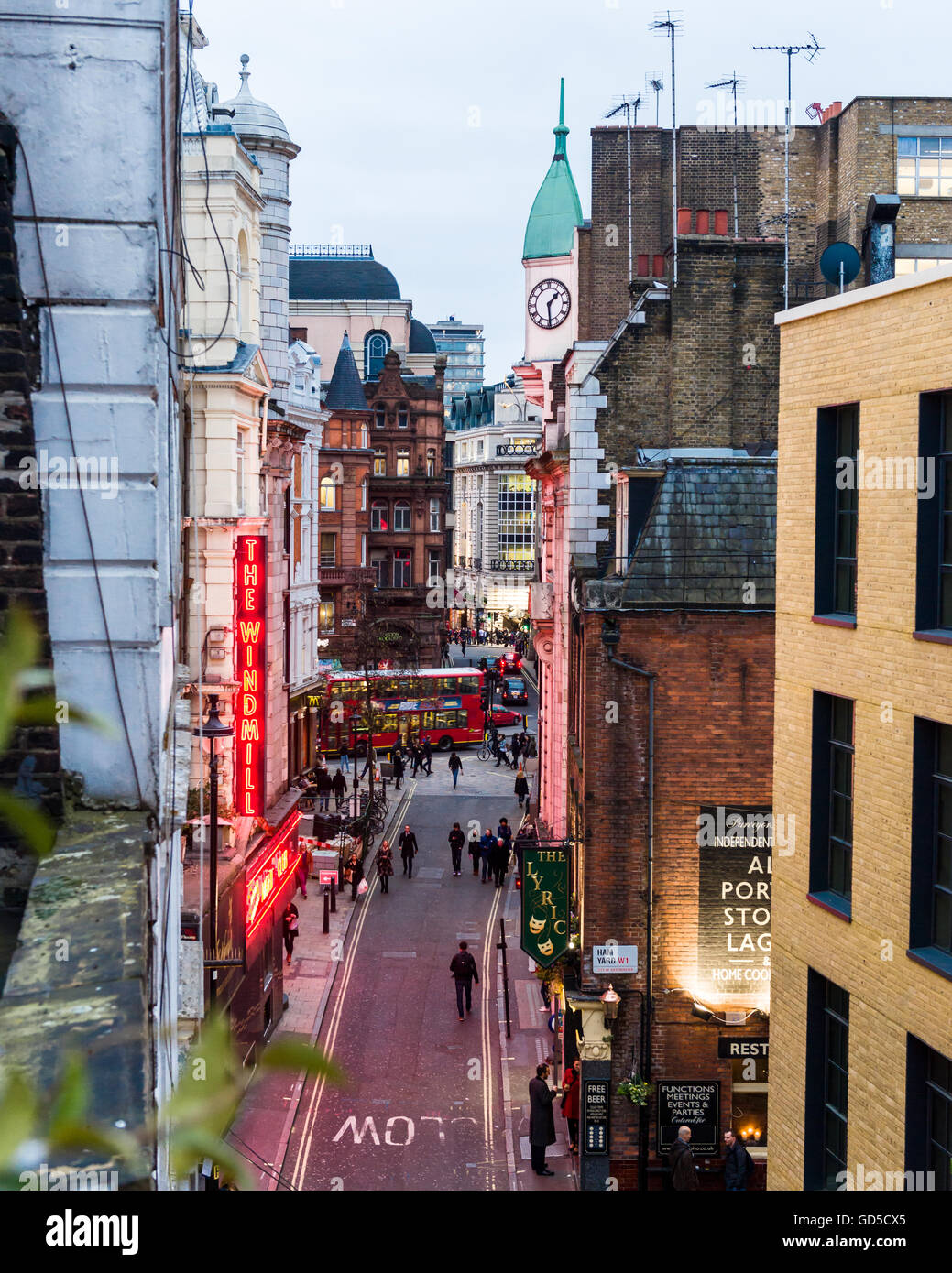 The neon signs of the Windmill theatre seen from a flat on Windmill Street. Stock Photo