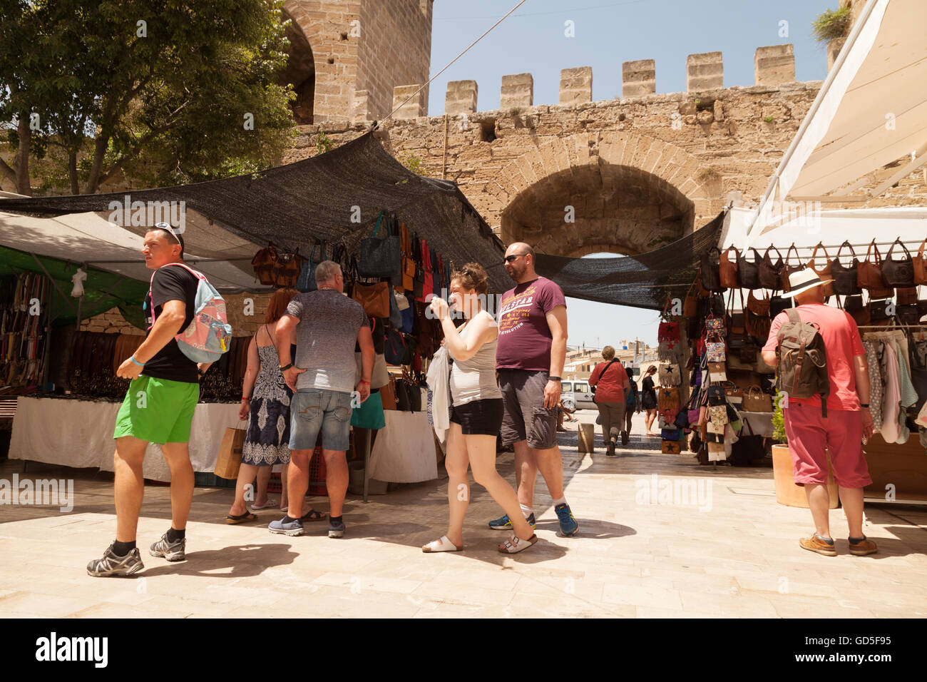 Tourists and local people in Alcudia old town centre, north Mallorca ( Majorca ), Balearic Islands, Spain Europe Stock Photo