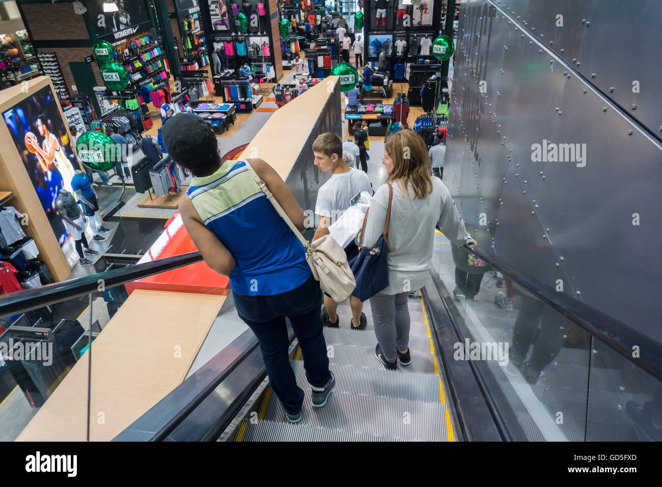 Shoppers on an escalator in the new Dick's Sporting Goods store in