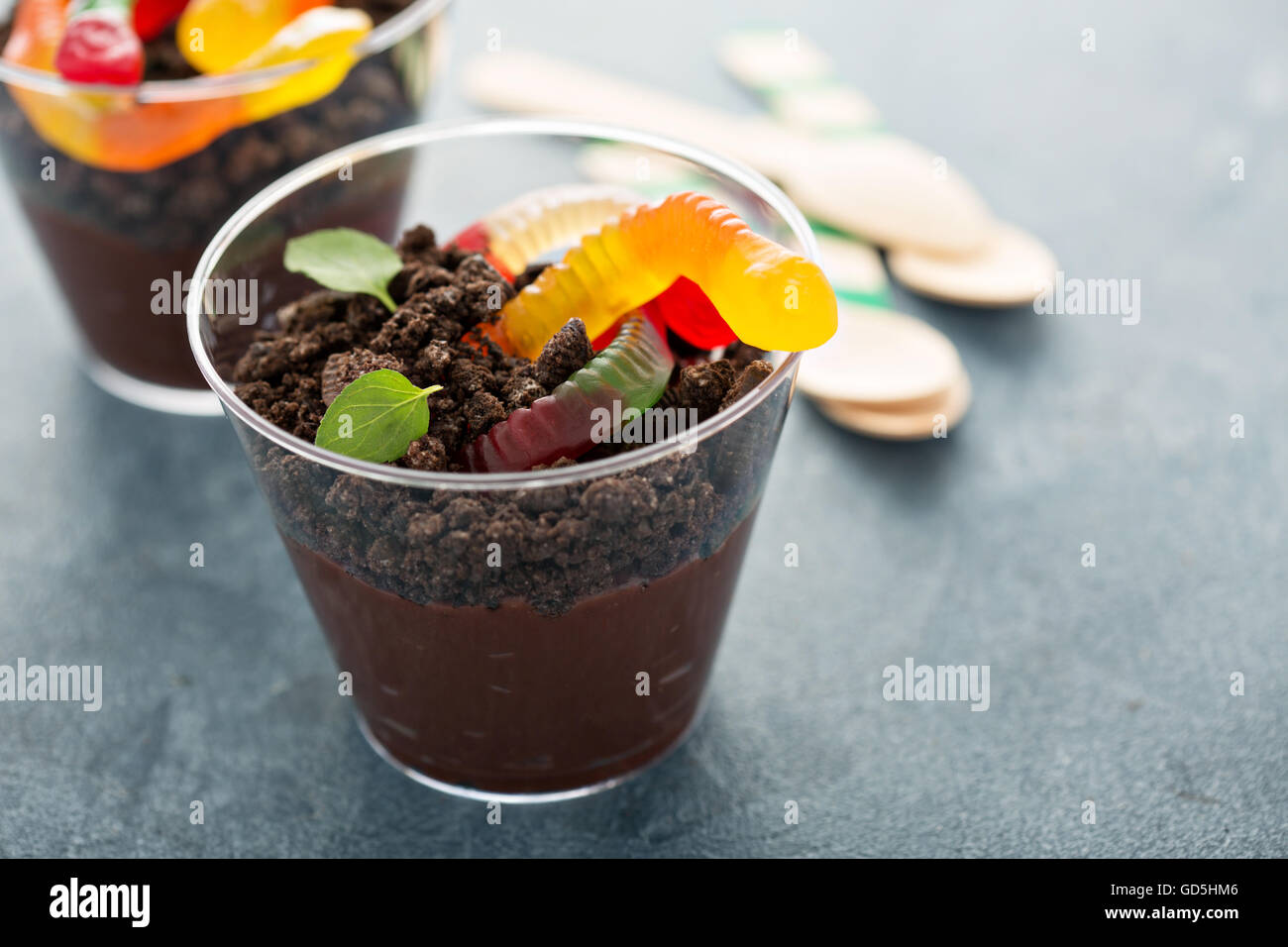 Children chocolate dessert in a cup dirt and worms Stock Photo