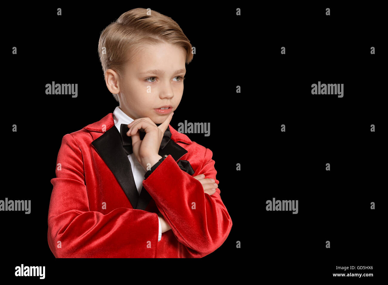 serious little boy in a tuxedo Stock Photo Alamy