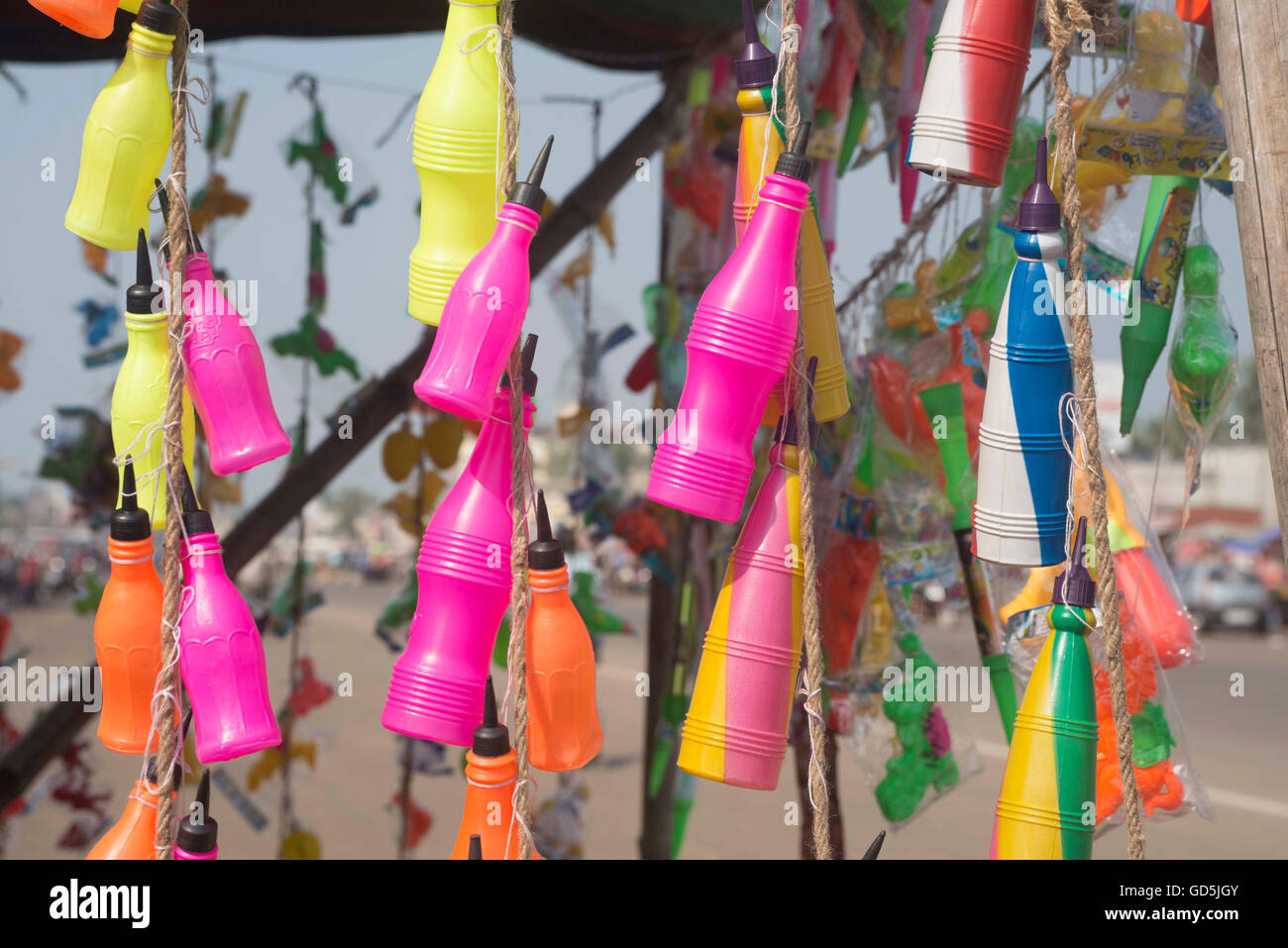 Plastic bottle pichkari hanging outside stall, puri, orissa, india, asia Stock Photo