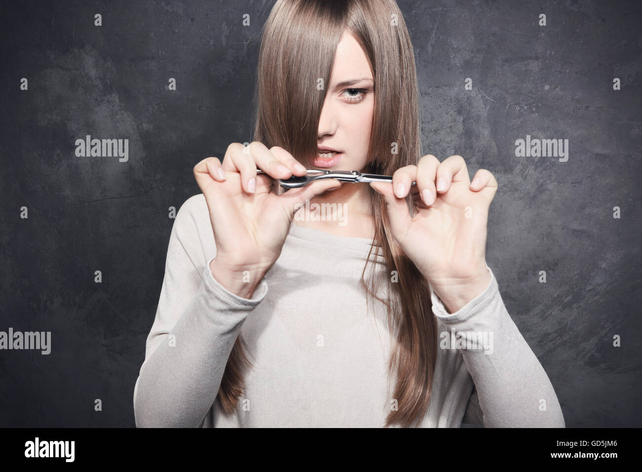 Girl with scissors Stock Photo