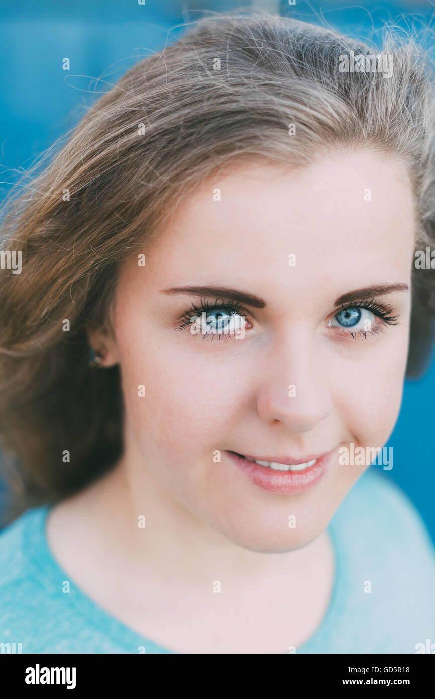 Close Up Of Attractive Plus Size Young Woman. Girl Looking At Camera. Blue Eyes Stock Photo