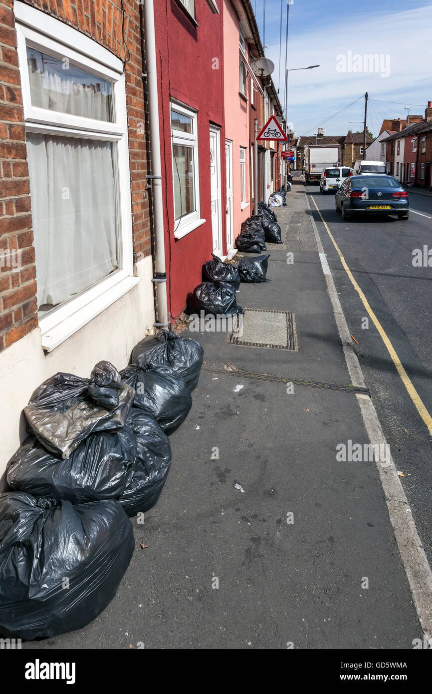 Black plastic bags refuse terraced houses hires stock photography and