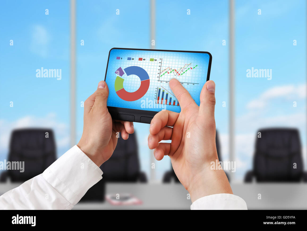 hand holding digital tablet pc with stock chart Stock Photo - Alamy