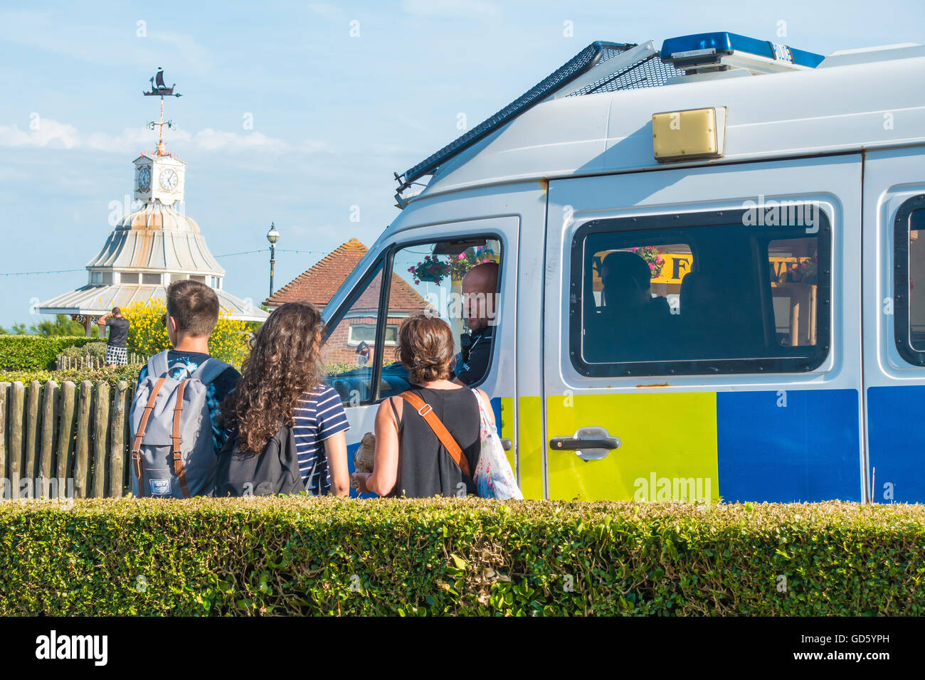 Police Speaking to Teenagers on Seafront Stock Photo