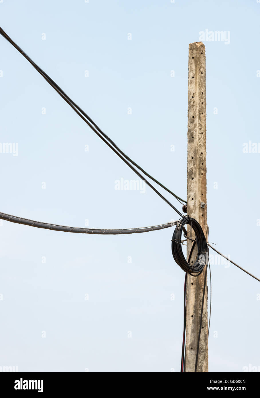 Roll up of the telephone cable on the electric pole in the rural area. Stock Photo