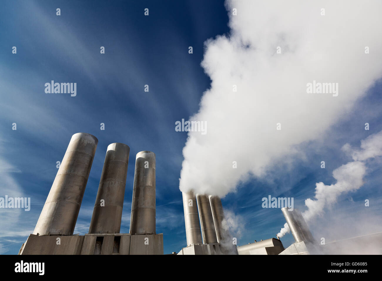 Clean geothermal steam bellows from pipes, Reykjanes Geothermal Power Plant, Iceland Stock Photo