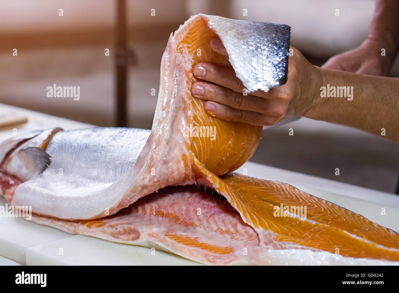Man's hand holds fish meat. Meat of raw fish. Best salmon for cooking ...