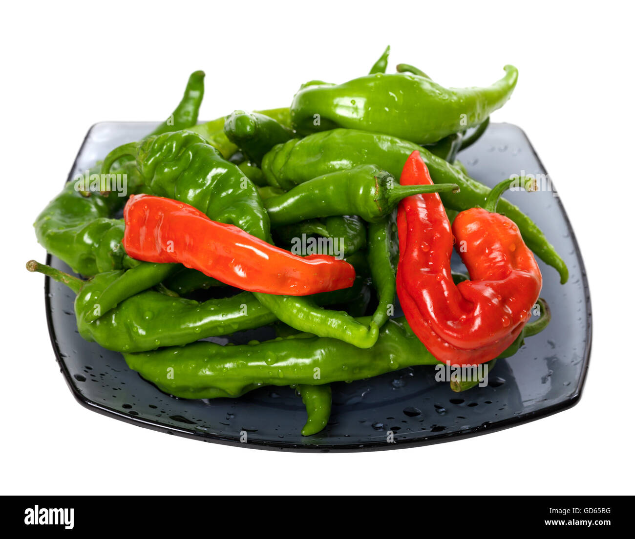 Green and red chili peppers on glass plate. Isolated on white ...